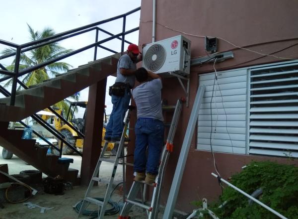 high energy efficiency Air-Conditioning Units in select public buildings in Caye Cualker